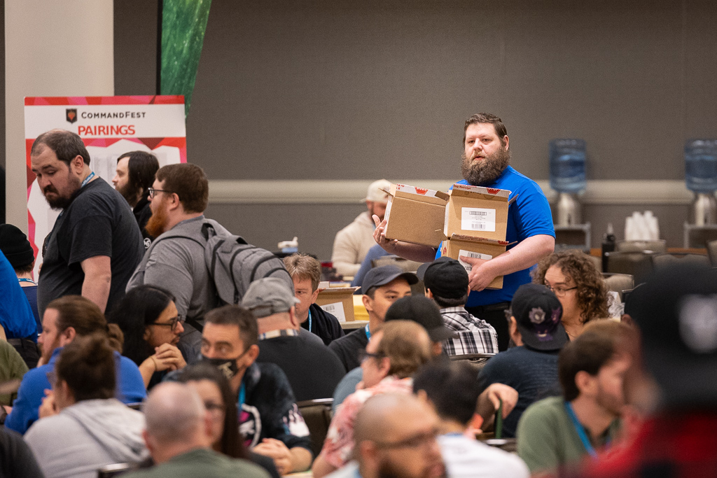 Mitchell prepares to distribute prerelease kits at Commandfest Dallas in 2024. Photo © John Brian McCarthy