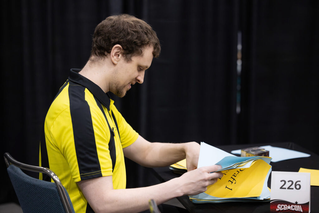 Brandon sorts decklists at Pro Tour Los Angeles in 2024. Photo © John Brian McCarthy