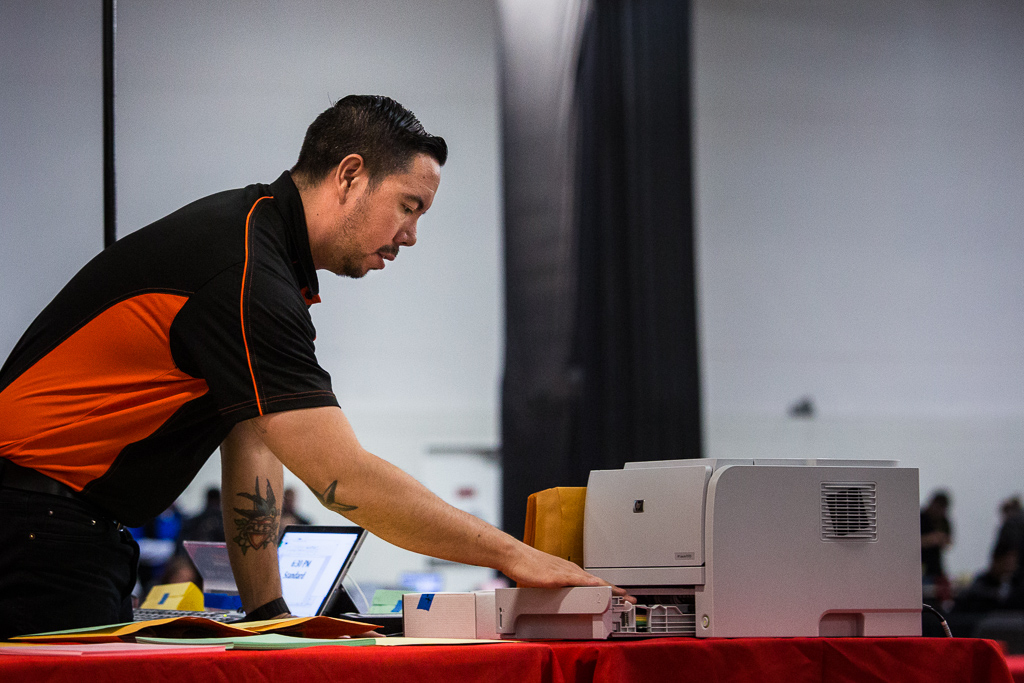 Chris battles the printer while scorekeeping at Grand Prix New Jersey in 2017. Photo © John Brian McCarthy