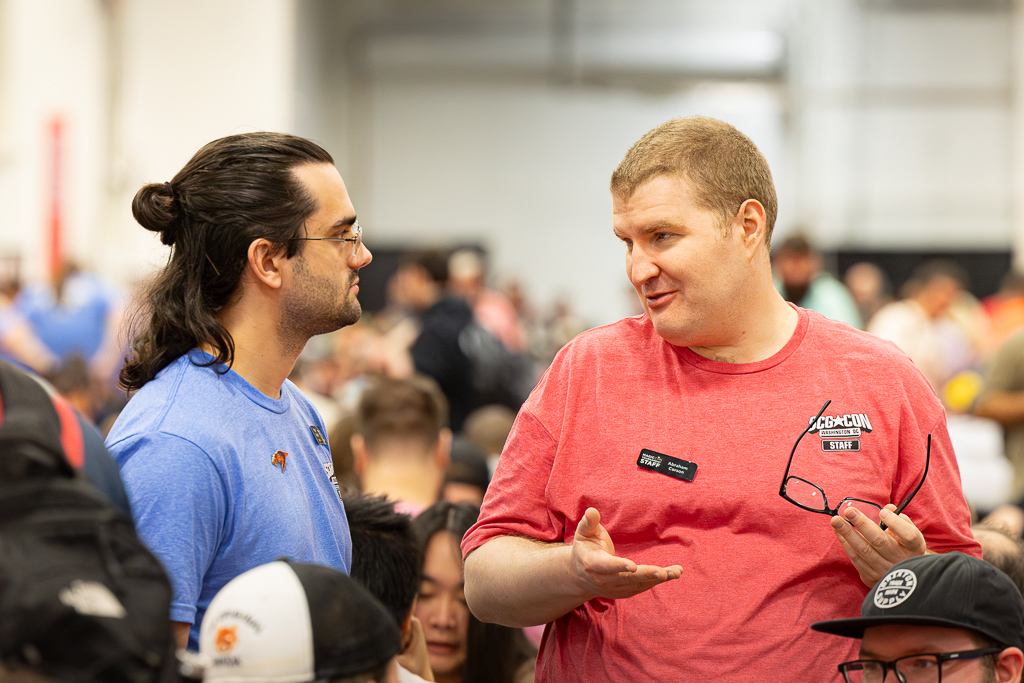 Ryan and Abe discuss a call at the Regional Championship at SCGCon DC in 2024. Photo © John Brian McCarthy