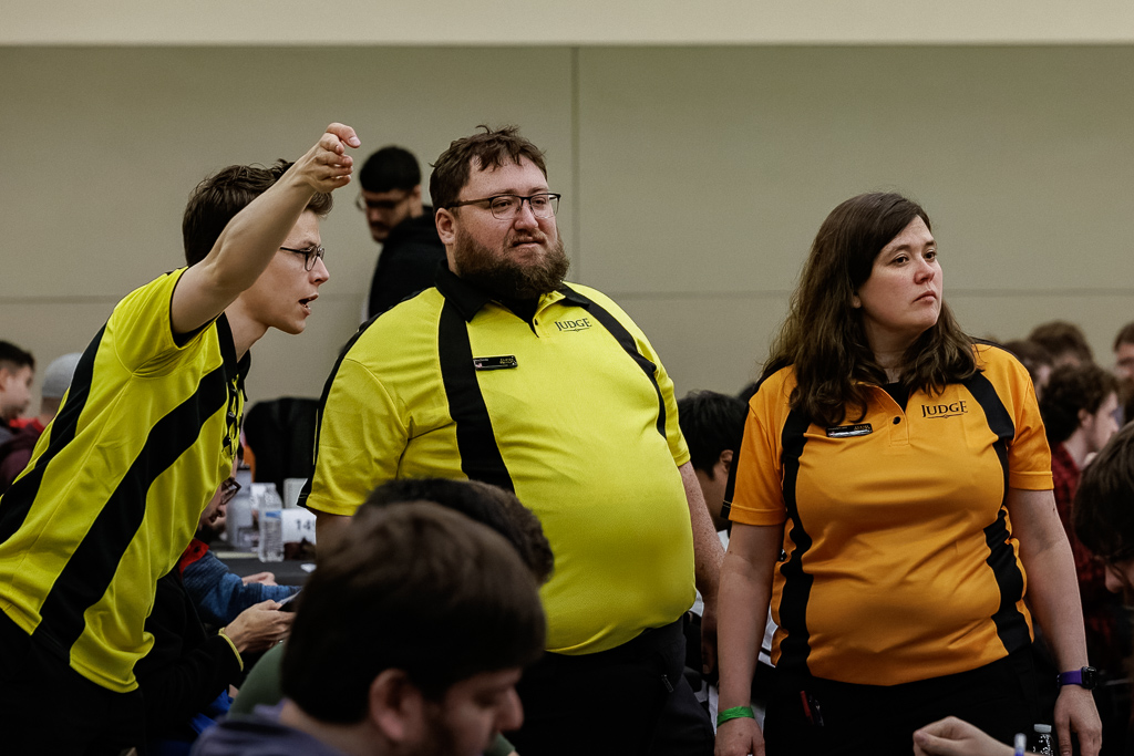 Ryan helps Ben and Amanda find a call at Pro Tour Baltimore in 2023. Photo © John Brian McCarthy