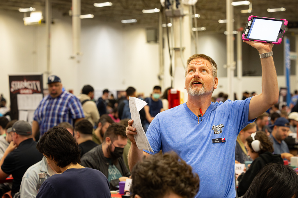 Aaron beseeches the wifi to cooperate while collecting lists at SCGCON DC in 2024. Photo © John Brian McCarthy