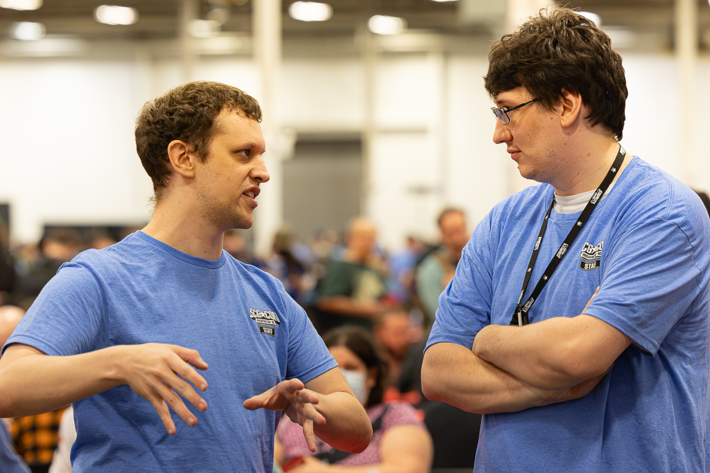 Brandon walks John through a call at SCGCON DC in 2024. Photo © John Brian McCarthy