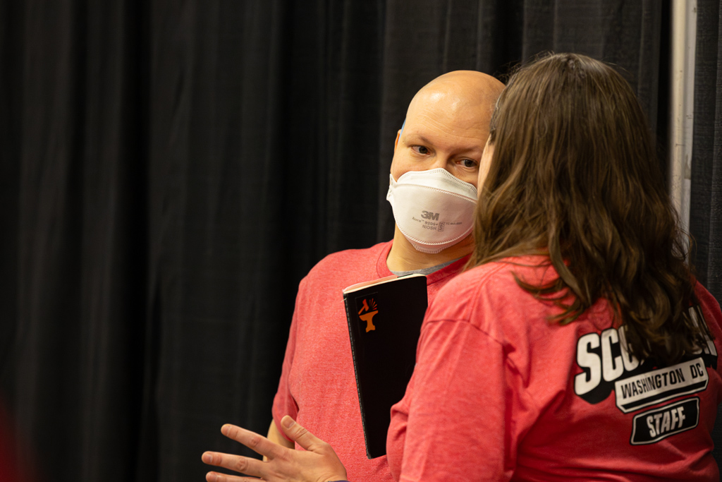 Paul listens as Amanda describes a situation at SCGCON DC in 2024. Photo © John Brian McCarthy